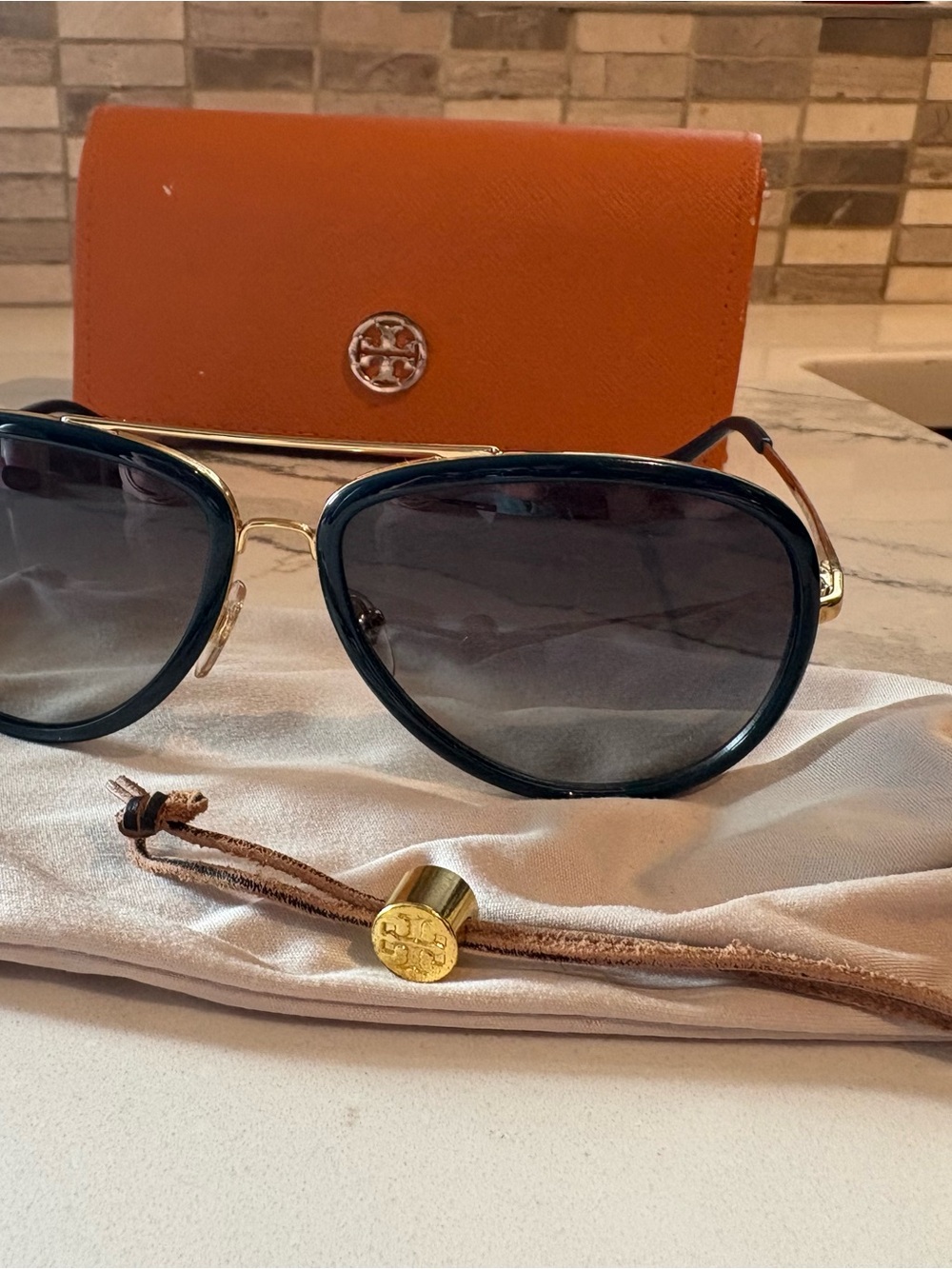 Tory Burch Black and Gold Aviator Sunglasses with Orange Case